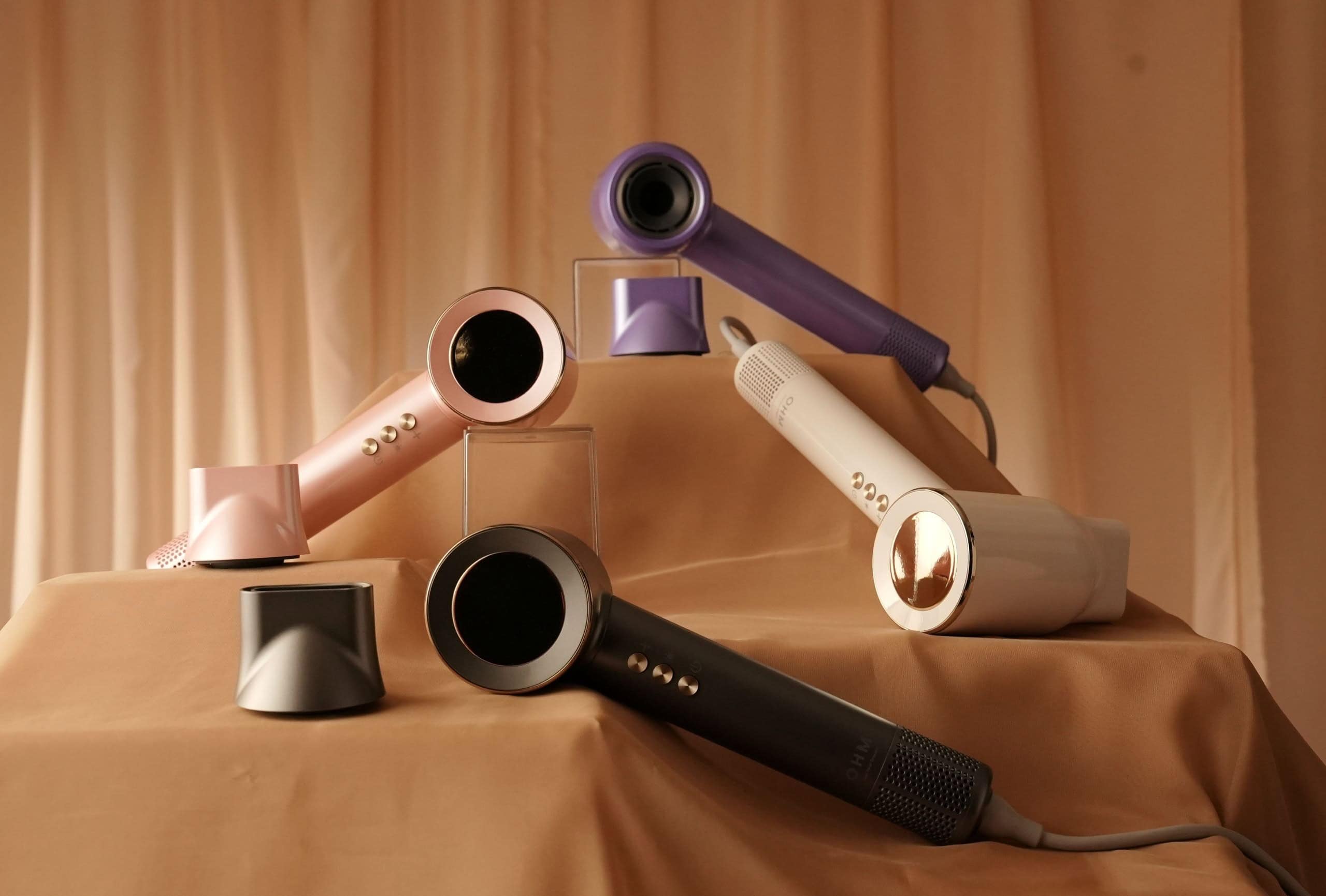 Colourful MY OHM Ultra+ hair dryers on display with accessories.